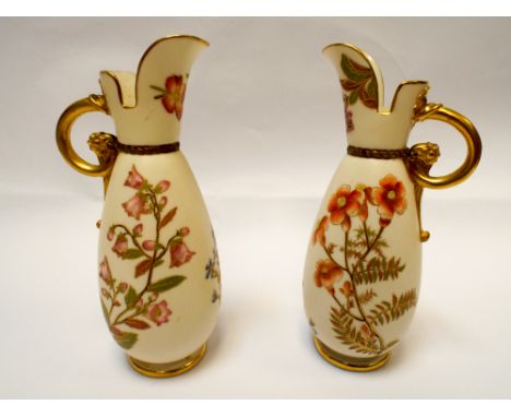 A pair of Royal Worcester blush ivory ewer's, shape number 1065, hand painted with sprigs of spring flowers with a scrolled h