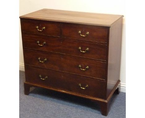 A late 18th century mahogany chest; the moulded top above two half-width and three full-width graduated drawers retaining ori