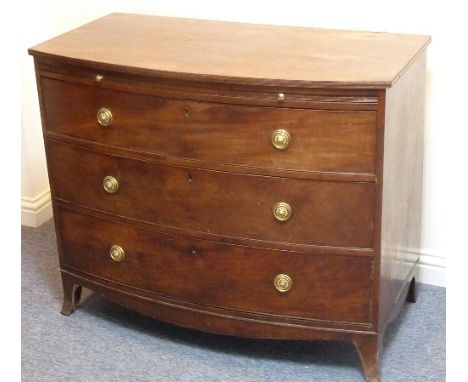 A Hepplewhite period bow-fronted mahogany Chest, reeded edge top above brushing slide and three full-width graduated drawers 