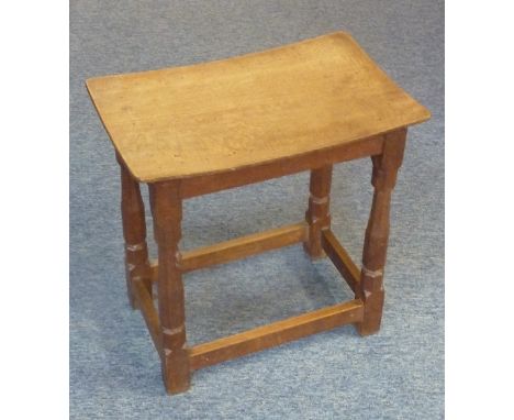 Robert 'Mouseman' Thompson of Kilburn; an early/mid-20th century oak Stool, the saddle-seat top above typical chamfered legs 