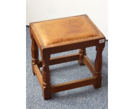 Robert 'Mouseman' Thompson of Kilburn; mid-20th century oak stool with signature mouse climbing  left hand leg, 36.5cm wide 