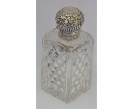 A fine hobnail-cut glass and silver-mounted Scent, the hinged lid decorated in repoussé style with 'C' scrolls, foliate ornam