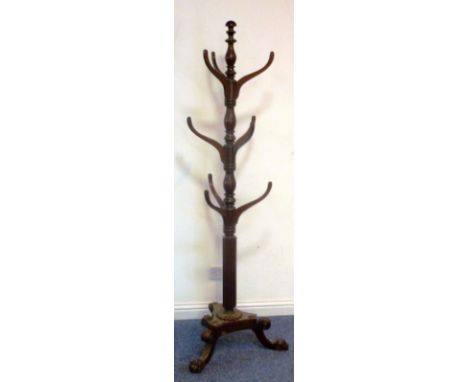 A good late-Regency period, country house style, mahogany Hat and Coat Stand; the rests above a reeded stem and triform base 