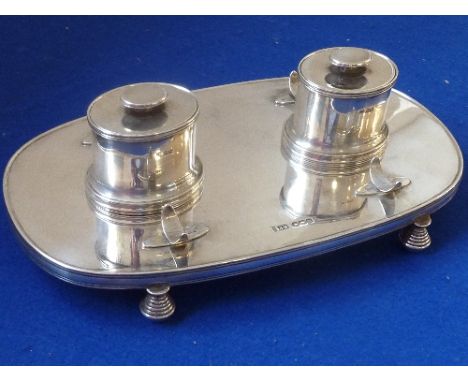 A rare, fine and heavy hallmarked silver Partners Inkstand; two oval inkwells with separate conforming covers and a pen-rest 