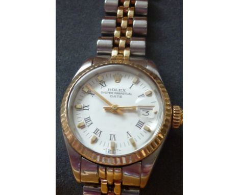 A ladies bimetal Rolex Oyster Perpetual Date wristwatch with baton markers and the date aperture at the 3 o'clock position, (