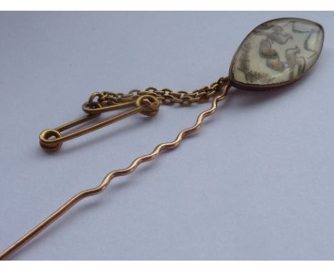 A George III period (probably late-18th century) rose gold coloured Stick Pin, the elliptical head decorated in neo-classical