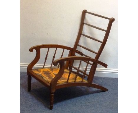A late 19th century adjustable oak Chair in Arts and Crafts style    CONDITION REPORT:  The horizontal backrests are a little