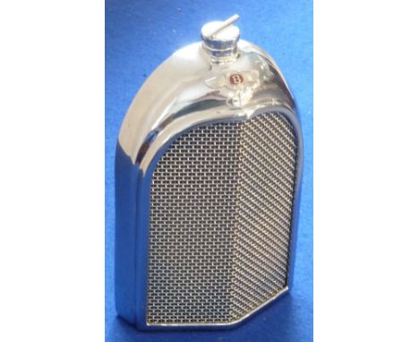 A stylish steel Decanter modelled as a Bentley radiator grill, the reverse marked Ruddspeed Ltd., 20cm    CONDITION REPORT:  