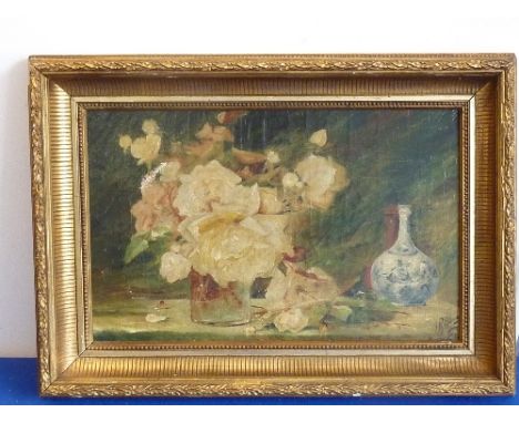 A gilt framed early 20th century Oil on Canvas still life study of roses in a glass jar with a Delftware-style bottle vase an
