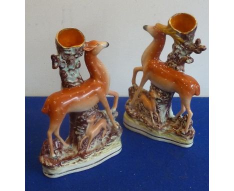 A pair of 19th century Staffordshire flatback Spill Vases modelled as stag and hind with fawn etc., 29cm    CONDITION REPORT: