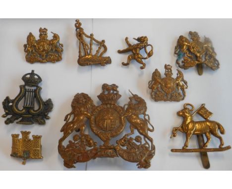Nine pouch and other British army badges: the Queen's Royal Regiment (West Surrey) [lamb and flag]; the Suffolk Regiment [cas