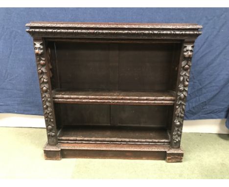 Heavily carved Black Forest style C19th four shelf book case 