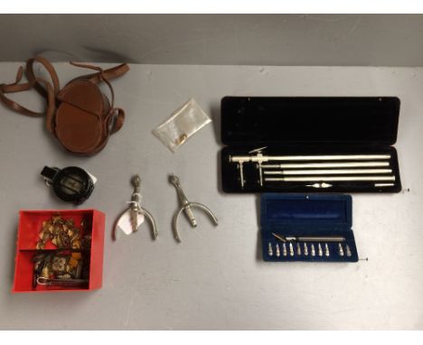 Box of Regimental buttons, badges etc, pair of spurs, prismatic military compass in leather case, graphos caligraphy pen &amp