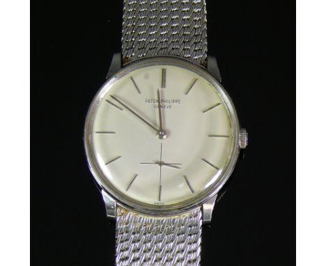 PATEK PHILIPPE-Herrenarmbanduhr (ca. 80er Jahre)Gehäuse und Flechtarmband in 18ct WG; Handaufzug; rundes Gehäuse D: ca. 32 mm
