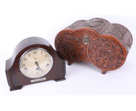 A sandalwood carved Oriental table chest and a 1940's wood cased mantle clock with chiming movement (2).