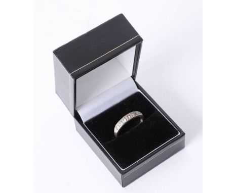 An 18ct white gold ring set with seven stones, approx 3.60gms.