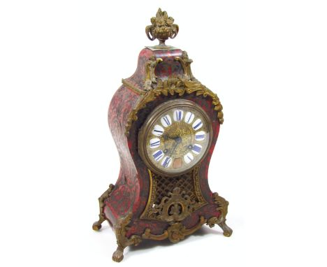 A 19thC Louis XIV style French Boulle and ormolu mantel clock, stamped Howell & James, Paris, the shaped case surmounted by a