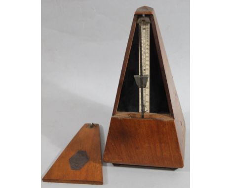 A mid 20thC Maelzel Parisian mahogany cased metronome, of tapering outline with hinged front revealing articulated interior, 