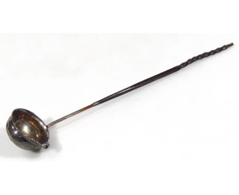 An early 19thC ladle, with lipped bowl and turned whalebone handle with metal finial, unmarked, 35cm wide