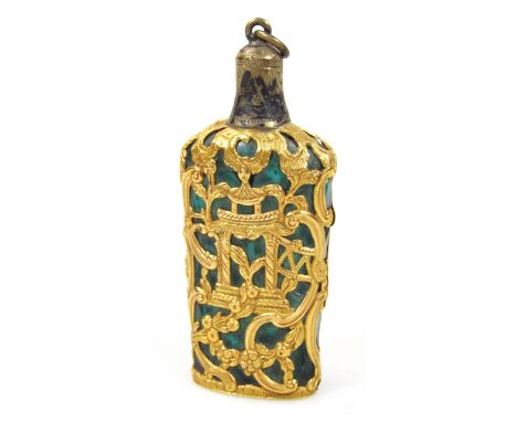 A 19thC jade coloured glass perfume bottle, with filigree piercing, decorated with urn scrolls, flowerheads, etc., of shoulde