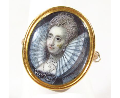 A portrait of a 16thC lady, wearing a ruff with hair up, in gold casing, in a ring setting, unmarked yellow metal, size L.