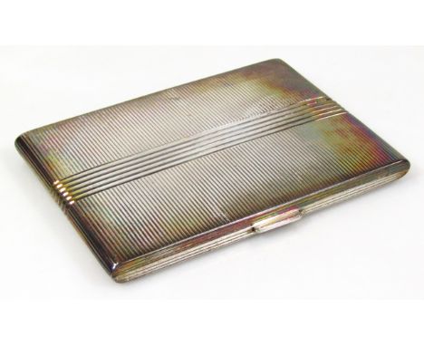 An Art Deco silver cigarette case, by K.W, of rectangular outline, with engine turned and line decoration, silver gilt interi