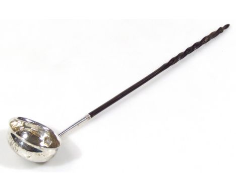 A George III silver ladle, by Robert Hennell, with compressed oval bowl and turned whalebone stem, London 1773, 33cm wide