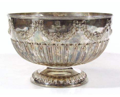 A Victorian silver monteith bowl, by William Hutton & Sons, the circular body repousse decorated with a repeat garland flower