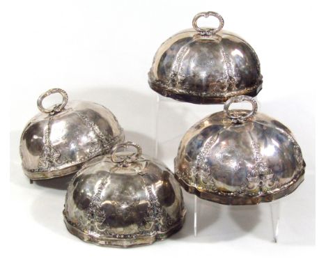 A set of four Victorian silver food covers, by Garrards, each with (removable) scroll handles, the compressed domed bodies, e