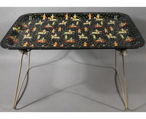 A mid 20thC Worcester ware kitsch tray, in repeat decorated with polo players resting on a black ground, with articulated sup