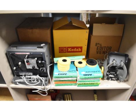 A vintage Kodak Instamatic projector for Super 8 movies, a Phago 8mm editor viewer and a selection of boxes of 8mm reel and c