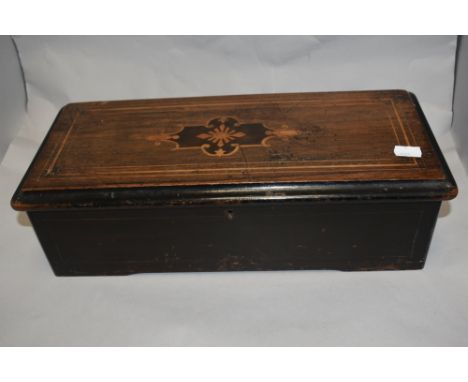A late Victorian 'Swiss' six air cylinder music box, of hinged rectangular form with inlaid decoration to cover, 43cm scuffin