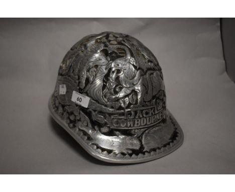 A moulded silver tone safety helmet, bearing designs of wild animals and the name Jack Cowbourne, marked McDonald Standard Sa