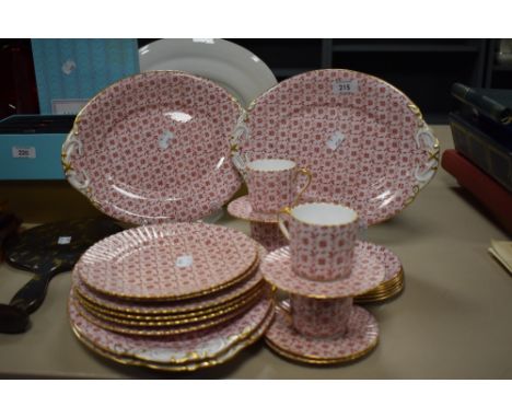A Continental / Bavarian part tea service, on pink ground and decorated with a floral chintz style pattern, heightened with g