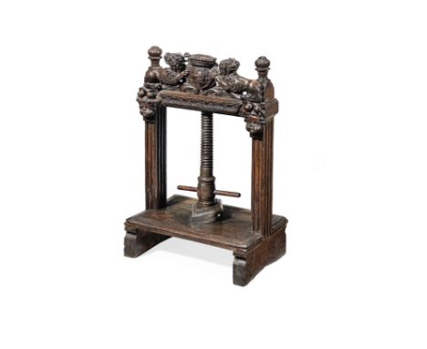 A 17th century carved oak table-top book press, Anglo-DutchWith fluted rectangular-section uprights topped by foliate-carved 