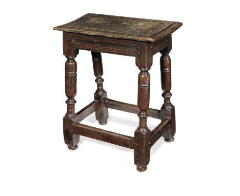 A Charles I oak joint stool, circa 1640 and laterThe top with double-reeded edge framed by a band of incised-carved navette a