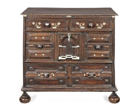 A Charles II joined oak and bone-inlaid chest of drawers, circa 1670With two short over two long deep drawers, having a denti