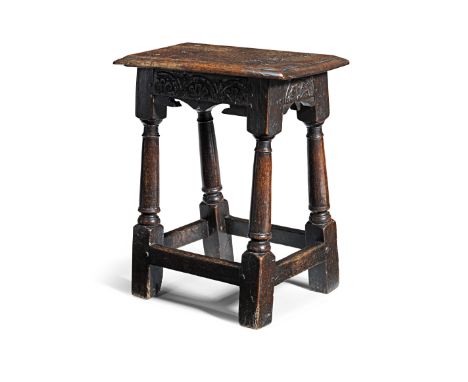 A good Charles I oak joint stool, circa 1640The top with double-reed edge, the shallow rails with bicuspid-shaped lower edge 