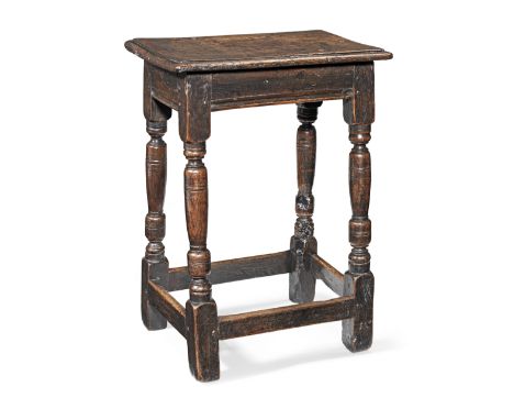A mid-17th century oak joint stool, English, circa 1650A particularly tall example, having a six-pegged top with ovolo-moulde
