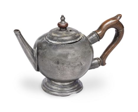 A rare George II pewter bullet-shaped touchmarked teapot, circa 1730Of typical diminutive size, with narrow faceted tapering 