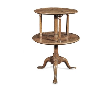 A George II oak two-tier tripod pedestal table, circa 1750Popularly referred to as a 'dumb-waiter'Having two graduated and di