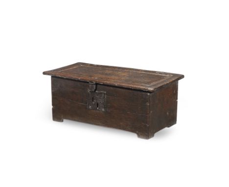 An unusual Elizabeth I/James I boarded oak box, circa 1600Of pegged-construction, the one-piece lid board carved to simulate 