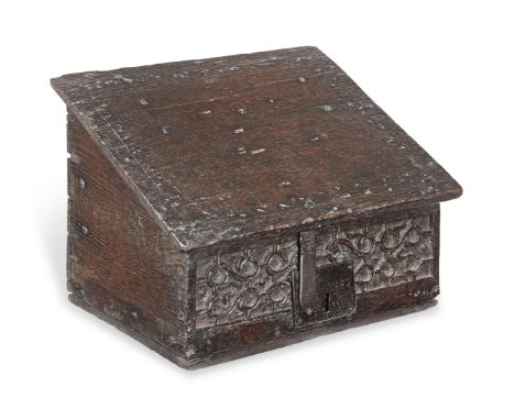 A small boarded oak desk box, English, circa 1600-20The hinged slope enclosing an interior fitted with till, the lid now lack