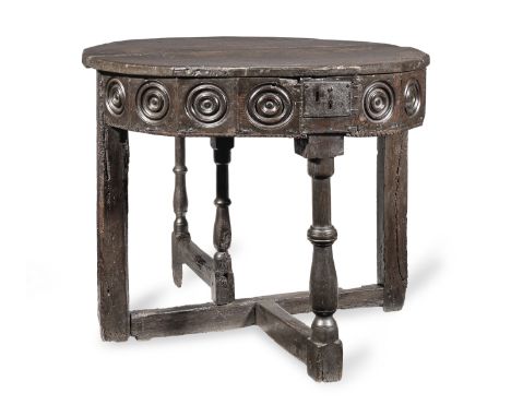 A rare mid-16th century joined oak folding-table with box-top, English, circa 1540-80The icosagonal top in two-parts, one par