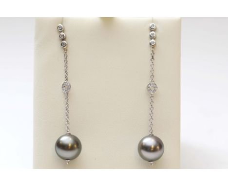 A pair of white gold diamond and South sea pearl earrings