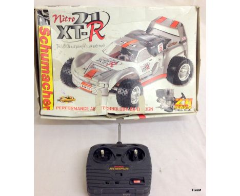 A Schumacher Intro 21 XT-R radio control car (petrol engine) 1/10th scale - boxed with accessories 