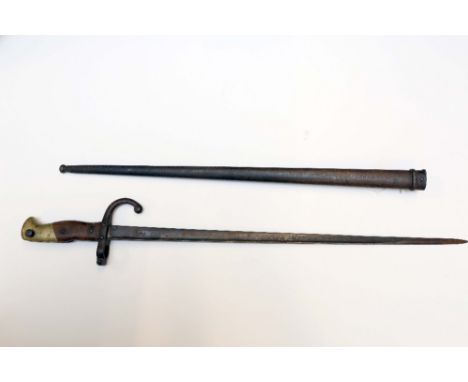 A French model 1874 Gras sword bayonet in scabbard manufactured at the L Denny Paris arsenal in 1879