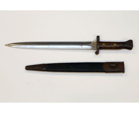 A Lee Metford pattern 1888 Mk 2 bayonet in black leather scabbard with steel mounts. Manufactured by Wilkinson of London in D