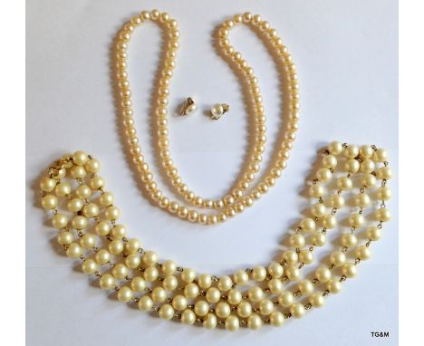 A pair of pearl necklaces and pearl clip earrings