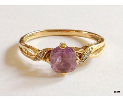 A 9ct gold hallmarked amethyst and diamond ring size P